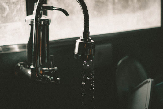 Dripping kitchen faucet over a sink